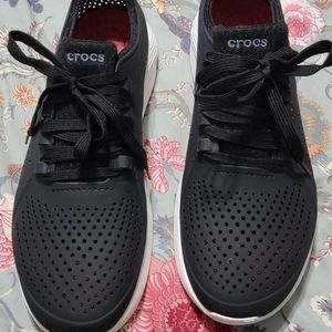 Mens Crocs shoes.